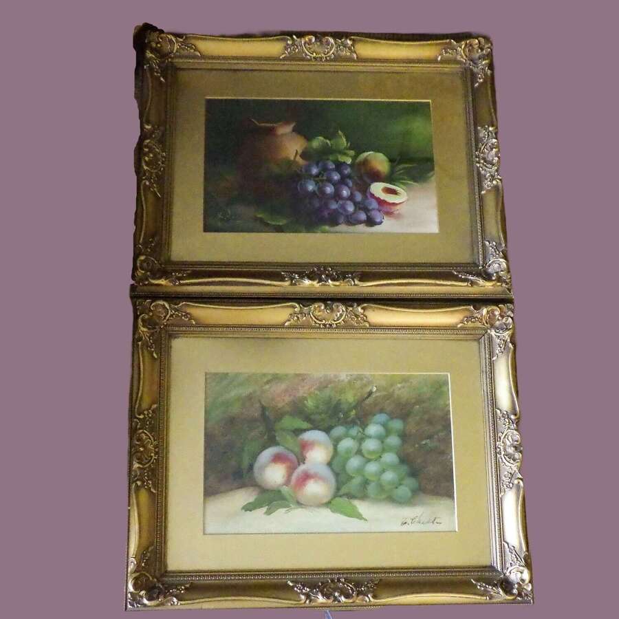 A pair of oil still life paintings of fruit, both signed.